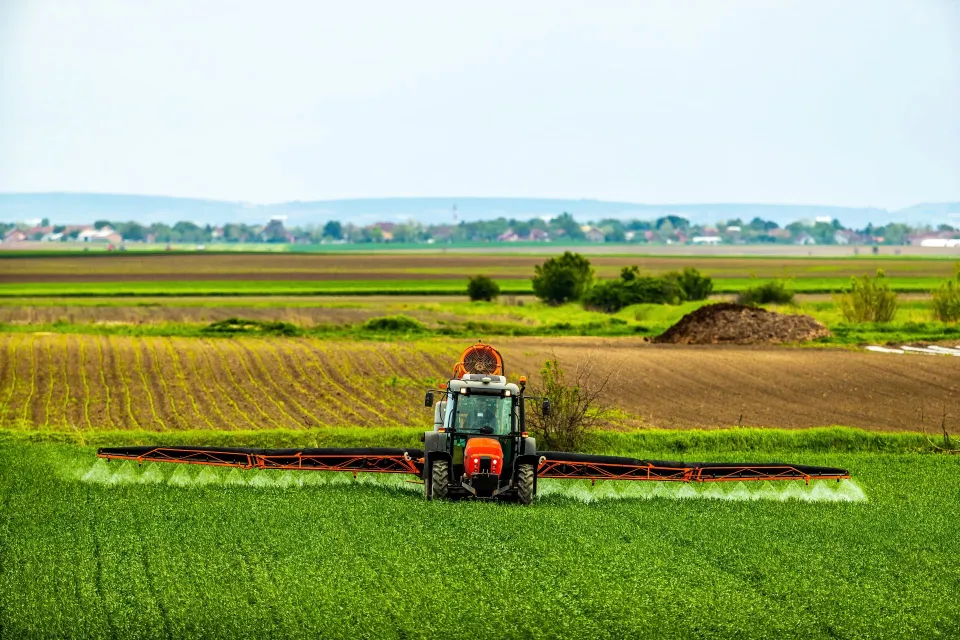 harvester on green field